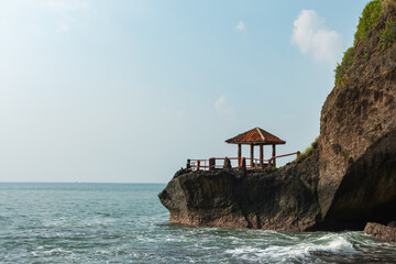 Beautiful view of the sea with a pavilion on top of a coral mountain