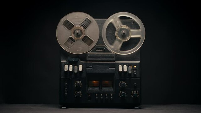 Tape audio music player, studio magnetic tape, vintage retro spool reel to reel player and recorder, magnetic tape data storage close up, music studio. 