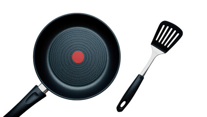 Frying pan with red indicator and slotted spatula on kitchen cooking