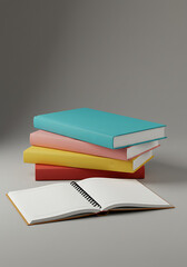 Stack of four colorful books with an open notebook in front, all against a neutral gray background.