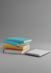 Stack of three colorful books, next to a white spiral notebook, against a plain gray background.
