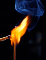 burning match on black