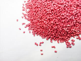 plastic masterbatch, oncolor red polymer masterbatch type cold cutting raw material granular, isolated on white background, for product catalog design of plastic manufacturing industry company profile