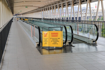 repair in progress sign near an Escalator, Sign showing warning of caution maintenance process,...