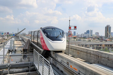 The pink monorail Mass Transit System serving in the Metropolitan Region.