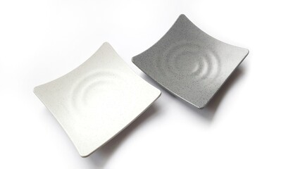 Empty square white and grey plates with ceramic melamin material isolated on white background
