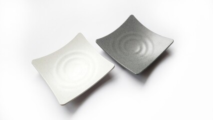 Empty square white and grey plates with ceramic melamin material isolated on white background
