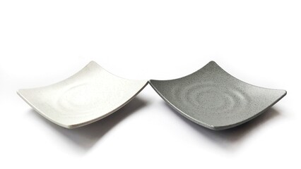 Empty square white and grey plates with ceramic melamin material isolated on white background