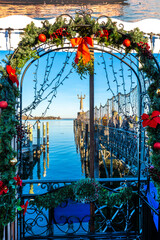 Christmas decoration with view of Imperia at Constance harbor on a clear winter day