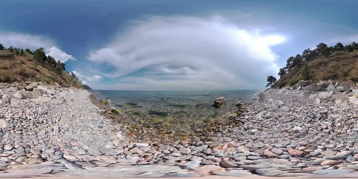 Lake Baikal, calm waves of clear water splashing on the rocky shore. Virtual immersion in the journey. 4K VR 360 degree video