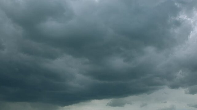 Dramatic and Chaotic Dark Clouds Loom Overhead, Creating a Gloomy and Turbulent Atmosphere