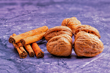 Walnuts and cinnamon on marble background
