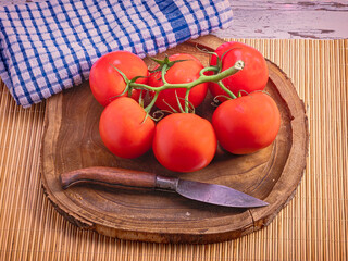 Fresh Vine Tomatoes on Wooden Cutting Board