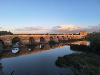 Fototapeta premium Ancient Roman bridge over the river