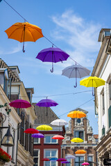 Colorful umbrellas above the streets Deventer. High quality photo