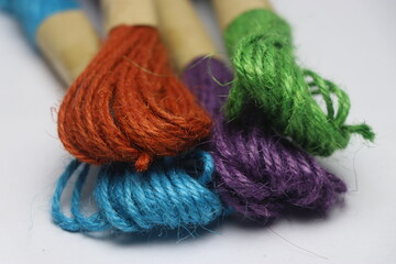 Multicolored jute strings close up view. Group of colored natural jute thread
