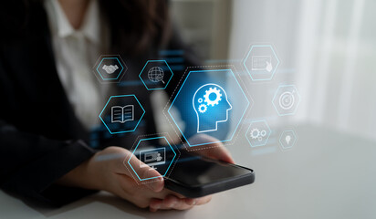 Head with gear and icons representing learning, digital training, and development process, showing...