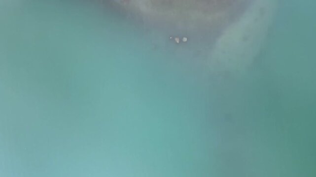 Aerial nature top down of water by Colico village in Lake Como Italian Alps in Lombardy