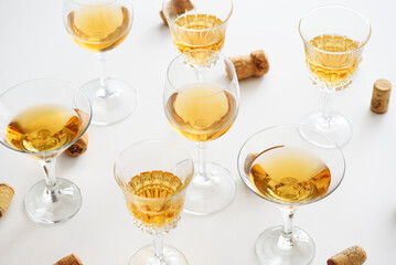 Set of glasses of yellow wine at wine tasting