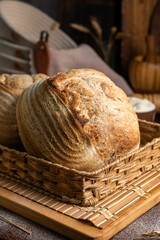 Healthy, organic, whole and sliced ​​homemade sourdough bread with ham and cheese on a wooden...