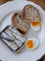 Healthy Breakfast with Boiled Eggs, Sardines and Sourdough Bread