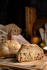 Healthy, organic, whole and sliced ​​homemade sourdough bread with ham and cheese on a wooden...