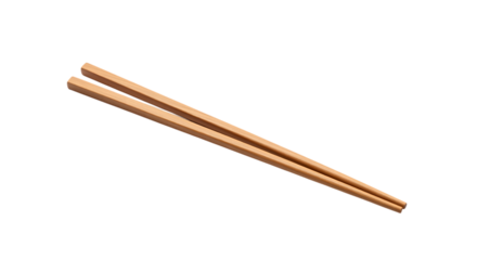 Pair of natural wooden chopsticks crossed diagonally isolated on transparent background