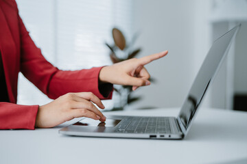 Crop shot of woman hand works on laptop Bookkeeper or financial inspector hands with copy space making the report and calculating. Home finances, investment, economy, or insurance concept