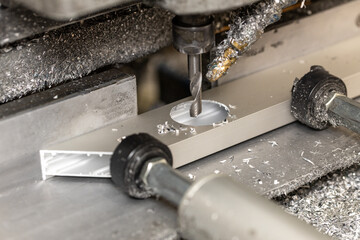 Milling holes for hinges in aluminum profiles