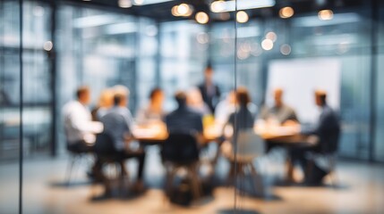 Blurred corporate business meeting with glass walls depicting teamwork, collaboration, and professional partnership in an office.