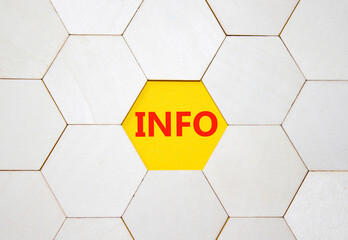 Info symbol. Concept word Info on wooden comb puzzle. Beautiful yellow background. Business and...