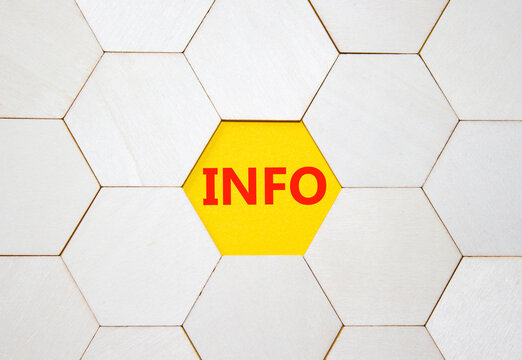 Info symbol. Concept word Info on wooden comb puzzle. Beautiful yellow background. Business and Info concept. Copy space.