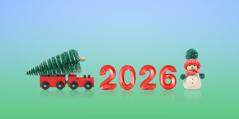 New Year 2026. Christmas card with a red train with a Christmas tree, a snowman, and the number 2026 on a blue and green background. Concept of a happy holiday. A fabulous postcard