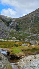 Rocky Mountain Slope and Stream with Distant Waterfall in Glendalough Valley, Ireland