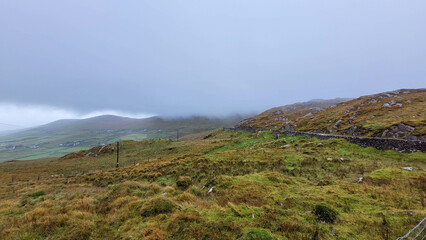 Foggy Irish Hills with Rocky Terrain and Old Stone Wall