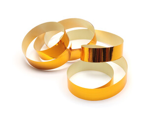 Yellow glow Gold color wave silk ribbon with light shadow on white background.