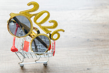 inflation and rising food prices new year 2026 effect on household economy and supermarkets. Trolley with glasses year 2026. copy space