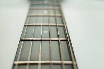 Close-up shot of an acoustic guitars fretboard and body, emphasizing craftsmanship and detail Used...