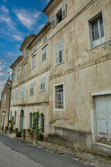 Historic Motovun street with traditional shuttered buildings, Croatia