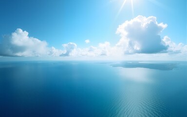 Obraz premium An aerial view of eternal blue sea or ocean with sunny and cloudy sky. High quality