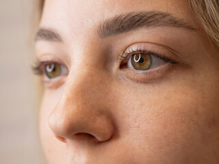 Fototapeta premium Close-up portrait of a woman after eyelash lamination procedure. 