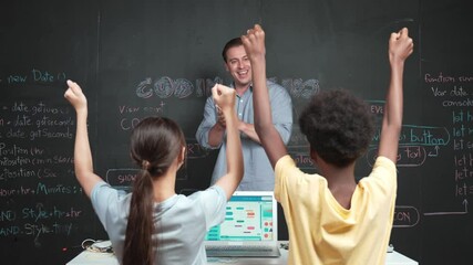 Teacher turn around and clapping hands to celebrate successful project while student raised arms with happiness. Instructor applause high school children to inspire to coding program. Edification - Powered by Adobe