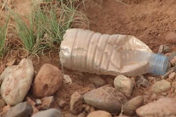 Plastic bottle lying on the ground
