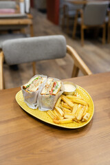 club sandwich for dinner with cheese and meat and fried potatoes
