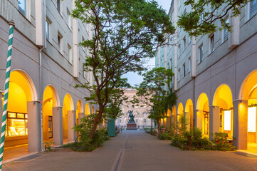 Quiet cobbled street in Nikolai Quarter at dawn in Berlin Germany with soft lighting and historic buildings
