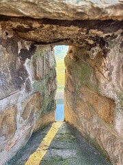 View of river through an old stone loophole in historic fortress