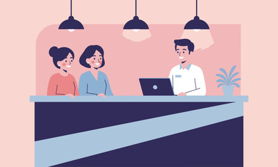People at Help Desk with Laptops