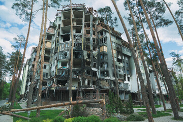 Burned apartment building after Russian attack in Kyiv region