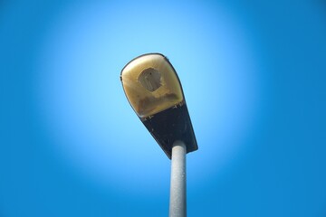 street lamp with broken glass on blue background