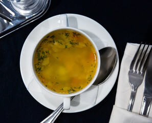 Top view of vegetable soup served in white plate. Vegetarian concept